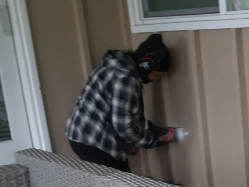 Professional electrician installing an exterior outlet in Saddlebrooke